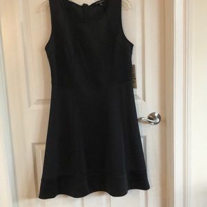New black dress, never worn. Size 14, brand Sharagano.
